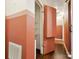 Hallway featuring built-in shelves, wood flooring, and two-tone paint at 827 Fairbanks Rd, Charlotte, NC 28210