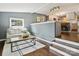 Comfortable living room with a sofa, hardwood floors, and kitchen view at 827 Fairbanks Rd, Charlotte, NC 28210
