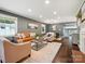 Spacious living room boasts hardwood floors, neutral decor, and abundant natural light at 827 Fairbanks Rd, Charlotte, NC 28210