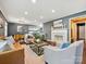 Bright living room showcasing a fireplace, hardwood floors, and stylish furnishings at 827 Fairbanks Rd, Charlotte, NC 28210