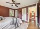 Bedroom showing window, bed, ceiling fan, doorway, and beautiful design at 827 Fairbanks Rd, Charlotte, NC 28210
