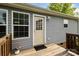 Back door on a wooden deck provides easy access to the backyard at 835 Jet St, Kannapolis, NC 28081