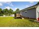 House exterior with a deck and a large backyard on a sunny day at 835 Jet St, Kannapolis, NC 28081