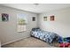 bedroom with a twin bed, carpet, window and neutral colors at 835 Jet St, Kannapolis, NC 28081