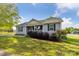 Exterior view of home featuring a long driveway and nice lawn at 835 Jet St, Kannapolis, NC 28081