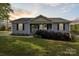 Charming single-story home featuring a welcoming front porch and well-maintained landscaping at 835 Jet St, Kannapolis, NC 28081