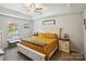 Comfortable main bedroom featuring tray ceiling, neutral colors, and carpeted floor at 835 Jet St, Kannapolis, NC 28081
