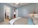 Neutral bedroom with access to bathroom and open doorway to other living spaces at 8605 Soaring Eagle Ln, Waxhaw, NC 28173