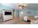 Large bedroom with tv, dresser and plenty of space, perfect for relaxing and unwinding at 8605 Soaring Eagle Ln, Waxhaw, NC 28173