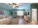 Oversized main bedroom with hardwood floors, a couch, and access to the en suite bathroom at 8605 Soaring Eagle Ln, Waxhaw, NC 28173