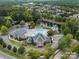 Aerial view showcasing the community pool, clubhouse, waterslide, and lake at 8605 Soaring Eagle Ln, Waxhaw, NC 28173