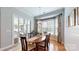 Cozy dining area with hardwood floors, natural light, and access to outdoor seating at 8605 Soaring Eagle Ln, Waxhaw, NC 28173