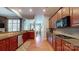 Open kitchen with granite countertops, wood cabinets, and stainless appliances at 8605 Soaring Eagle Ln, Waxhaw, NC 28173