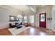 Bright living room with trey ceilings, large windows, and stylish furniture at 8605 Soaring Eagle Ln, Waxhaw, NC 28173