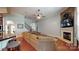 Spacious living room with fireplace, hardwood floors, and staircase to the second floor at 8605 Soaring Eagle Ln, Waxhaw, NC 28173