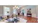 Spacious living room with hardwood floors, wainscoting, and ample natural light at 8605 Soaring Eagle Ln, Waxhaw, NC 28173