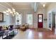 Bright living room with trey ceilings, large windows, and stylish furniture at 8605 Soaring Eagle Ln, Waxhaw, NC 28173