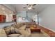 Inviting living room featuring a large sectional sofa and hardwood floors at 8605 Soaring Eagle Ln, Waxhaw, NC 28173