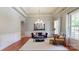 Bright living room with trey ceilings, large windows, and stylish furniture at 8605 Soaring Eagle Ln, Waxhaw, NC 28173