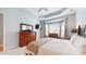 Comfortable main bedroom features bay window and large dresser at 8605 Soaring Eagle Ln, Waxhaw, NC 28173
