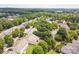 An aerial view showcasing the neighborhood with mature trees and manicured lawns at 8605 Soaring Eagle Ln, Waxhaw, NC 28173