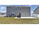 A spacious backyard with a concrete patio and well-maintained lawn provides ample outdoor living space at 9505 Cotswood Pl, Gastonia, NC 28056