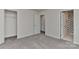 Spacious bedroom featuring neutral walls, plush carpeting, a double door closet and a full ensuite bathroom at 9505 Cotswood Pl, Gastonia, NC 28056