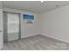 Serene bedroom boasts soft carpeting, a window with blinds and an ocean themed wall art at 9505 Cotswood Pl, Gastonia, NC 28056