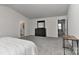A spacious bedroom features gray carpet, a dark dresser with a mirror, and ensuite bathroom access at 9505 Cotswood Pl, Gastonia, NC 28056