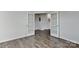 Spacious room with hardwood floors and glass doors, perfect for an office or playroom at 9505 Cotswood Pl, Gastonia, NC 28056