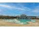 Resort-style community pool with clear blue water, surrounded by lounge chairs and lush landscaping at 9505 Cotswood Pl, Gastonia, NC 28056