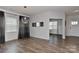Elegant dining room with hardwood floors, a modern light fixture, and ample natural light at 9505 Cotswood Pl, Gastonia, NC 28056