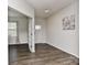 Bright entryway featuring hardwood floors, white walls, and an adjacent room with natural light at 9505 Cotswood Pl, Gastonia, NC 28056