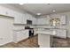 Modern kitchen features white cabinets, granite countertops, stainless steel appliances at 9505 Cotswood Pl, Gastonia, NC 28056