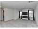 A cozy living room with modern entertainment center, fireplace, and soft natural light with neutral gray carpeting at 9505 Cotswood Pl, Gastonia, NC 28056
