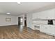 Beautiful living room features an adjacent nook space with white cabinetry and granite countertop at 9505 Cotswood Pl, Gastonia, NC 28056