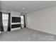 Modern entertainment center features a fireplace, tv, and recessed lighting over a neutral gray carpet at 9505 Cotswood Pl, Gastonia, NC 28056