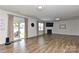 Bright living room with a fireplace, large windows, and a sliding door to the outdoor at 9505 Cotswood Pl, Gastonia, NC 28056