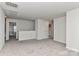 A spacious loft area features neutral carpet, white walls and access to multiple areas of the home at 9505 Cotswood Pl, Gastonia, NC 28056