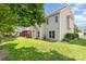 Spacious backyard with lush green grass, wooden pergola, and partial fence at 9593 Indian Beech Nw Ave, Concord, NC 28027