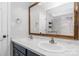 Bathroom featuring a double vanity with a wood-framed mirror and a shower at 9593 Indian Beech Nw Ave, Concord, NC 28027