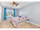 Bedroom with neutral carpet and walls, ceiling fan, and a view of the neighborhood at 9593 Indian Beech Nw Ave, Concord, NC 28027