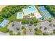 Aerial shot of the community center, pool, tennis courts, and surrounding neighborhood at 9593 Indian Beech Nw Ave, Concord, NC 28027