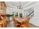 Dining room featuring a wood table set for six, molding, and open access to the home at 9593 Indian Beech Nw Ave, Concord, NC 28027