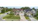 Charming two-story home showcasing a well-maintained yard, double garage, and inviting curb appeal at 9593 Indian Beech Nw Ave, Concord, NC 28027