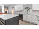 Modern kitchen with white cabinets, quartz countertops, stainless steel appliances, and a stylish island at 9593 Indian Beech Nw Ave, Concord, NC 28027