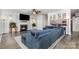 Comfortable living room with a fireplace, large sectional, and stylish decor for relaxing or entertaining guests at 9593 Indian Beech Nw Ave, Concord, NC 28027