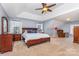 Spacious main bedroom with tray ceilings, ceiling fan, carpet, and natural light at 9593 Indian Beech Nw Ave, Concord, NC 28027