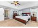 Spacious main bedroom featuring an en-suite bathroom, dresser, and windows at 9593 Indian Beech Nw Ave, Concord, NC 28027