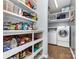 Well-organized pantry with open shelving and access to the laundry room at 9593 Indian Beech Nw Ave, Concord, NC 28027